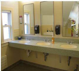 Figure 1. An example from our VL-RewardBench asking the visual details in a restroom. Open-source VL-GenRMs (Qwen2-VL-7B and Llama-3.2-90B) and the commercial model (Claude-3.5-Sonnet) all fail to provide accurate judgments.