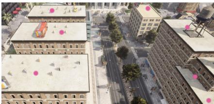 A drone simulation scene showing pink dots on rooftops identified as safe landing zones by a VLM.